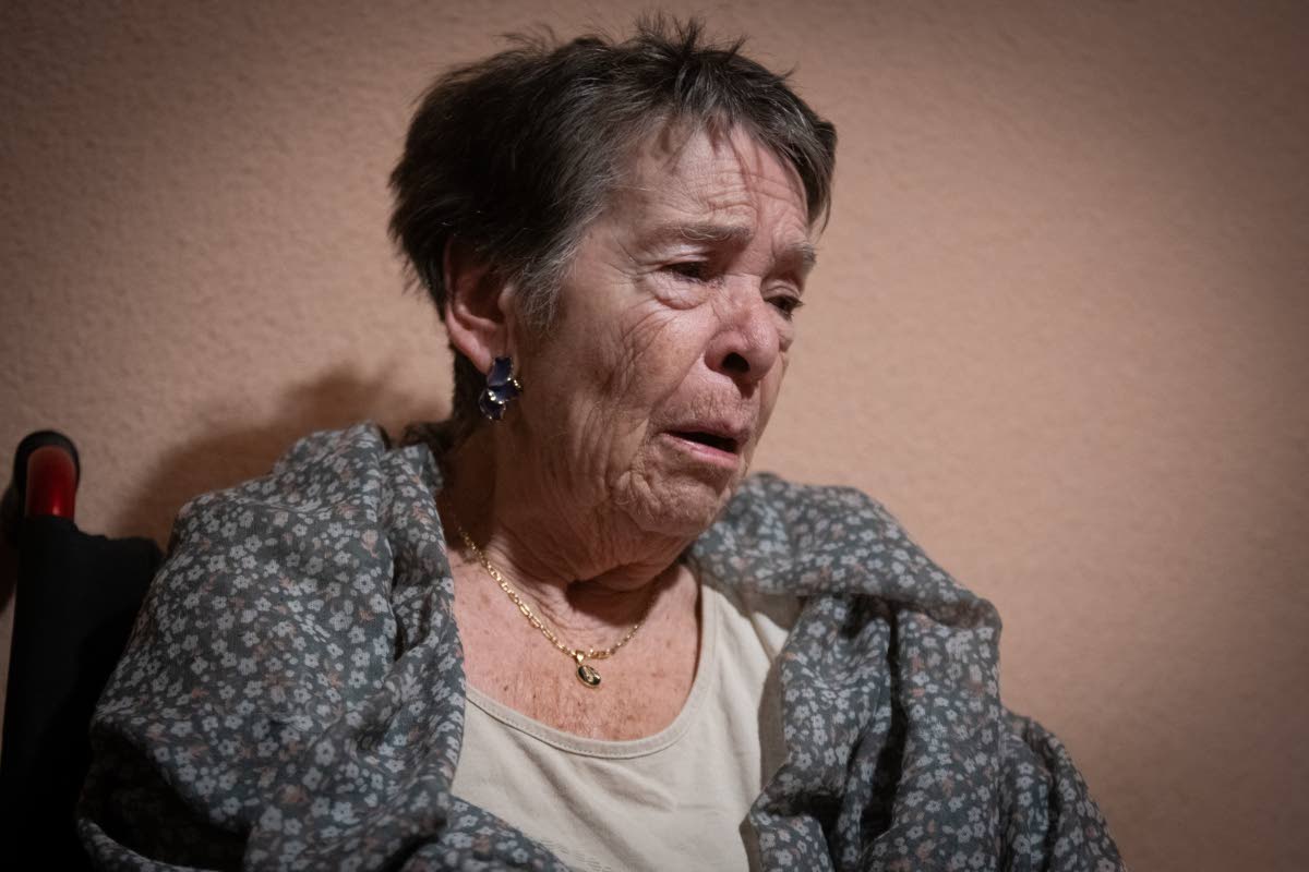 Maricarmen, 87, waits at home for police to arrive before being evicted from the home where she lived in Madrid, Spain, September 23.