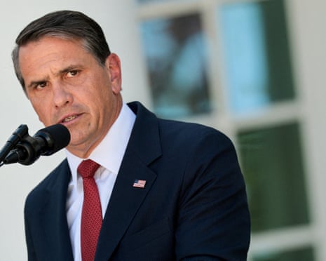 Attorney General Todd Blanche speaks into a microphone with a furrowed brow